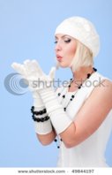stock-photo-woman-blowing-on-his-hands-on-a-blue-background-49844197.jpg